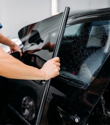 putting a window tint roll on a window