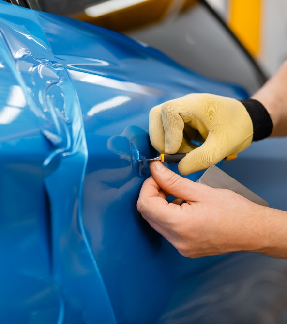fixing a tear in body wrap for a car